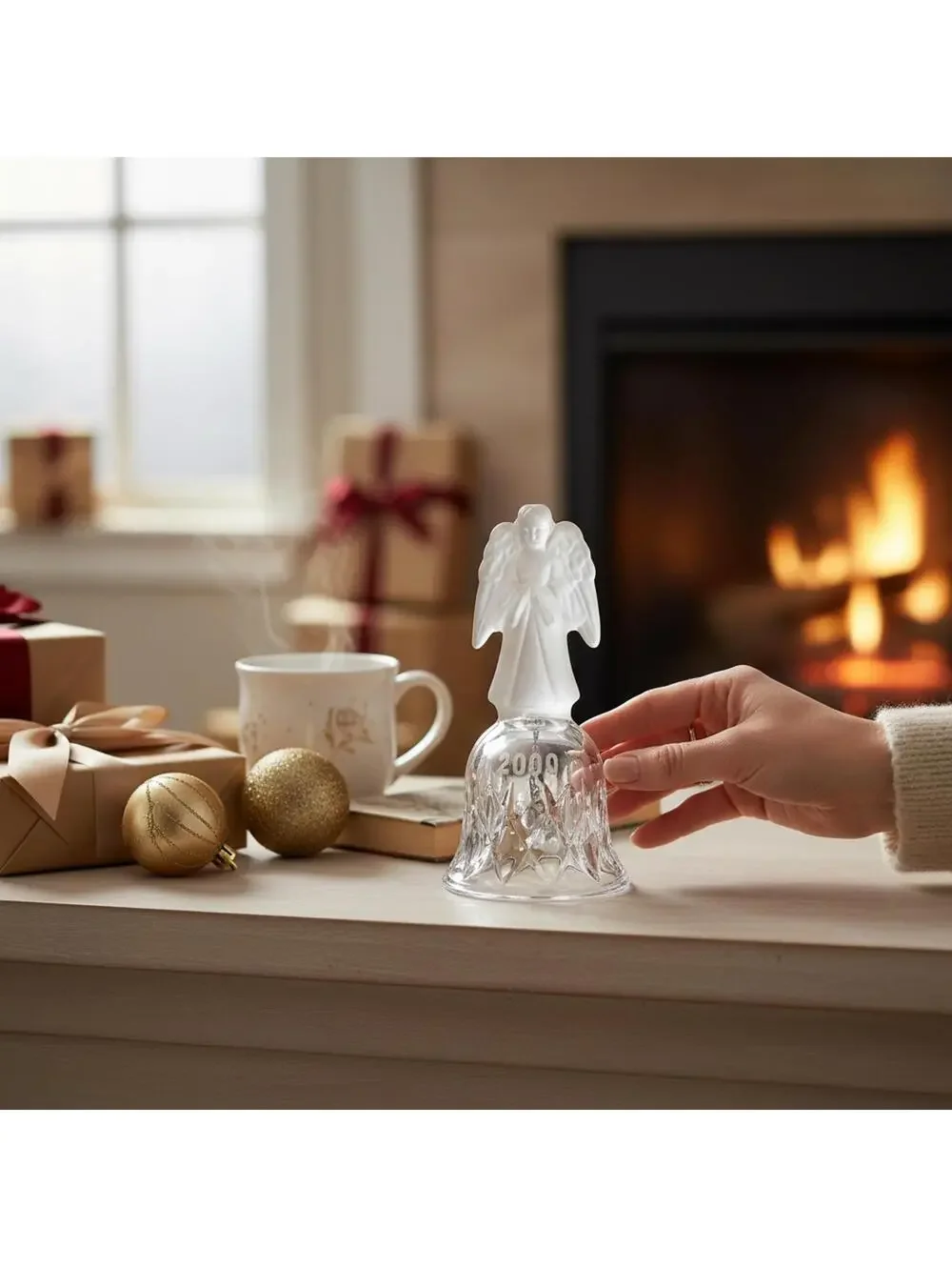 vintage frosted angel sits atop a crystal bell etched with the year 2001.